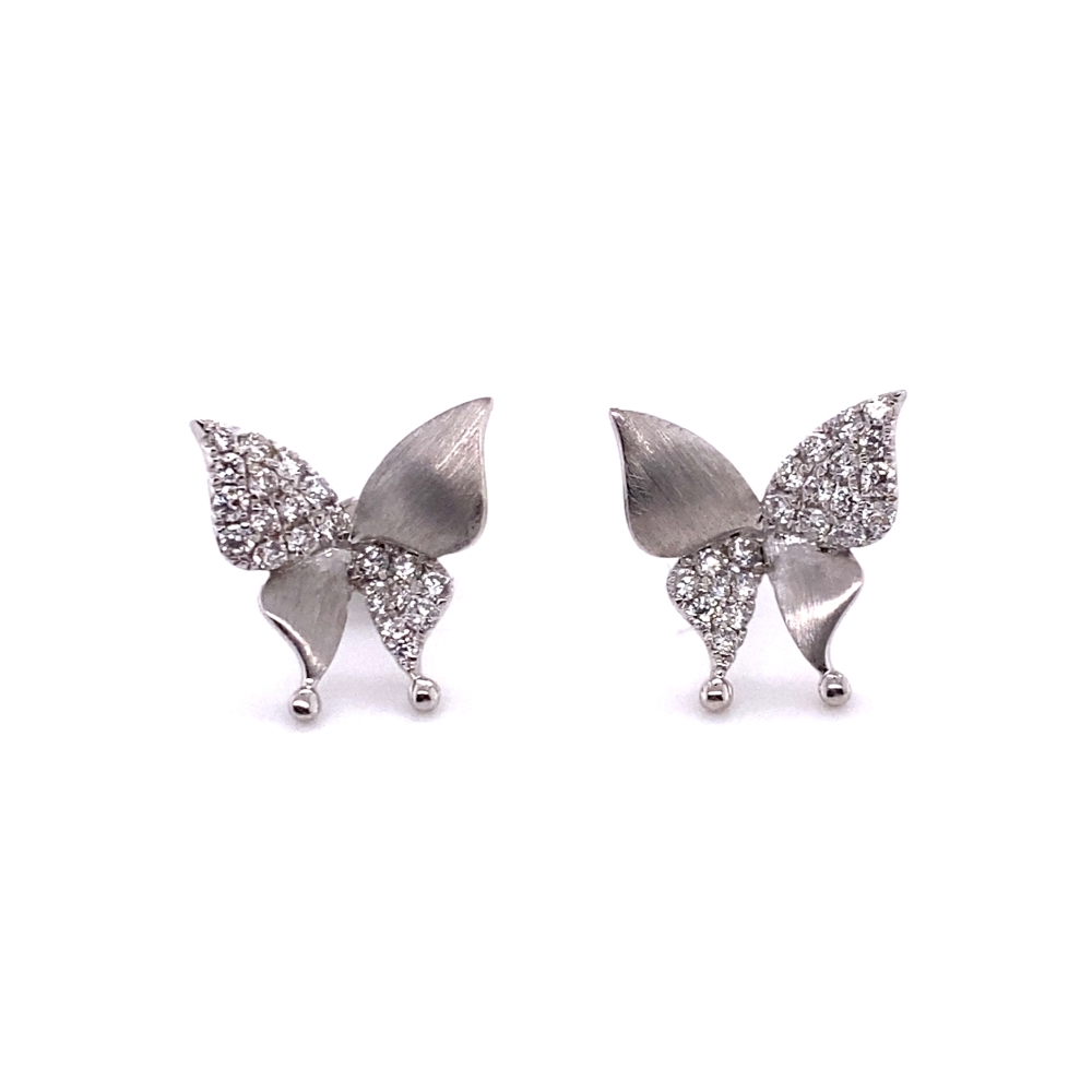 pair of silver earrings with crystal butterflies