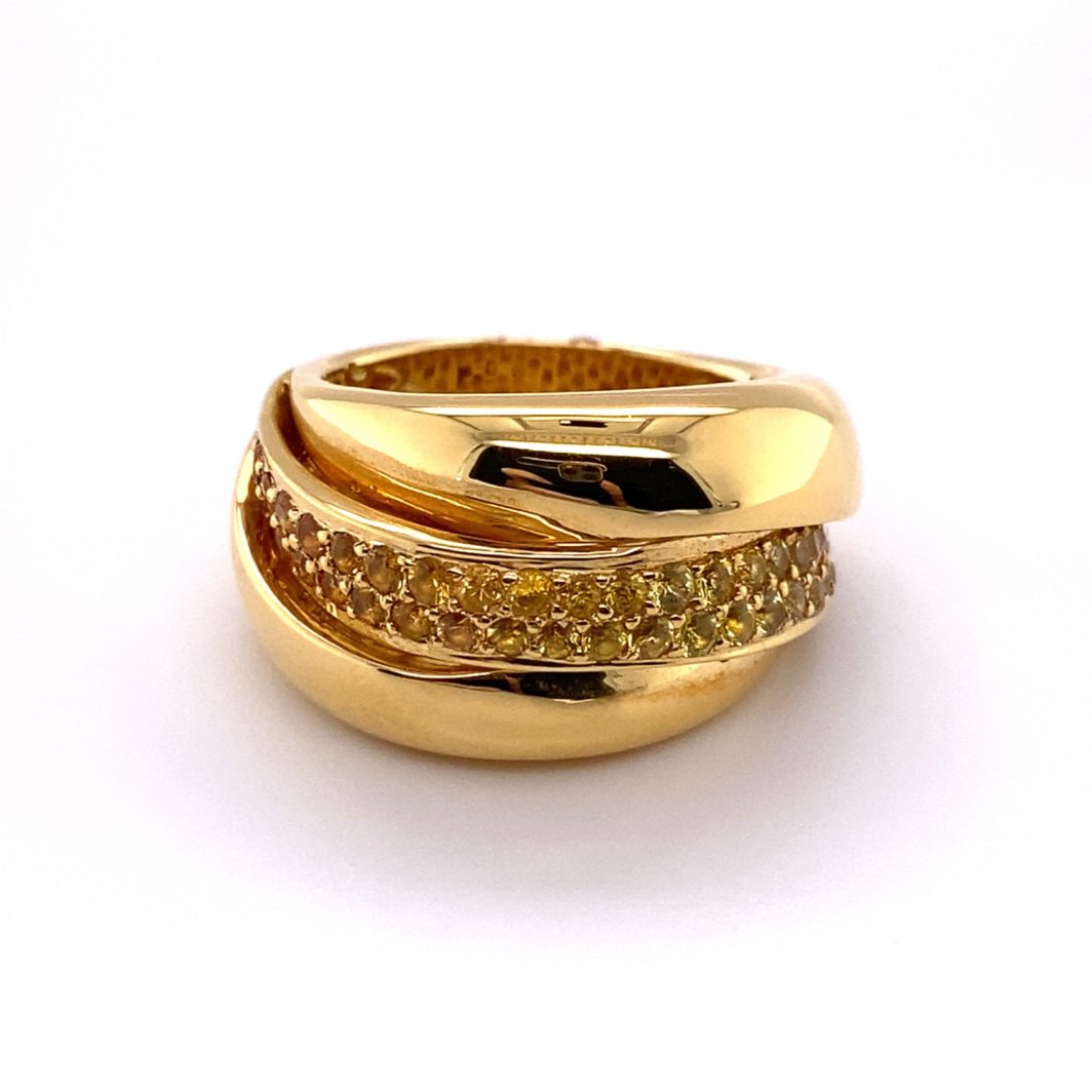 a gold ring with two rows of yellow diamonds