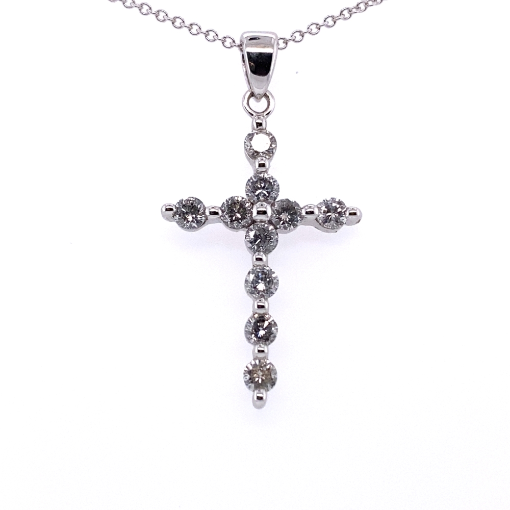 a silver cross with beads hanging from it