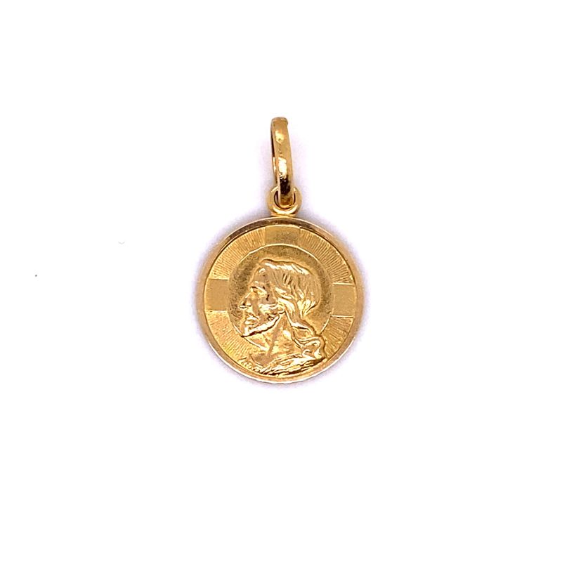 a gold medal with a woman's face on it