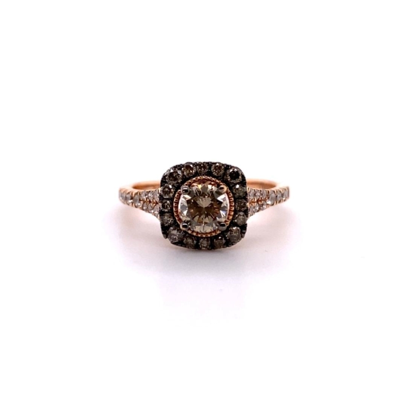 a brown and white diamond ring on a white background