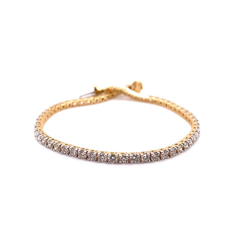 a gold bracelet with diamonds on it