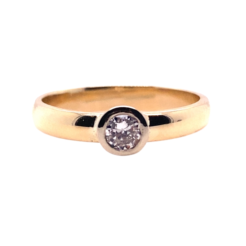 a yellow gold ring with a diamond in the center