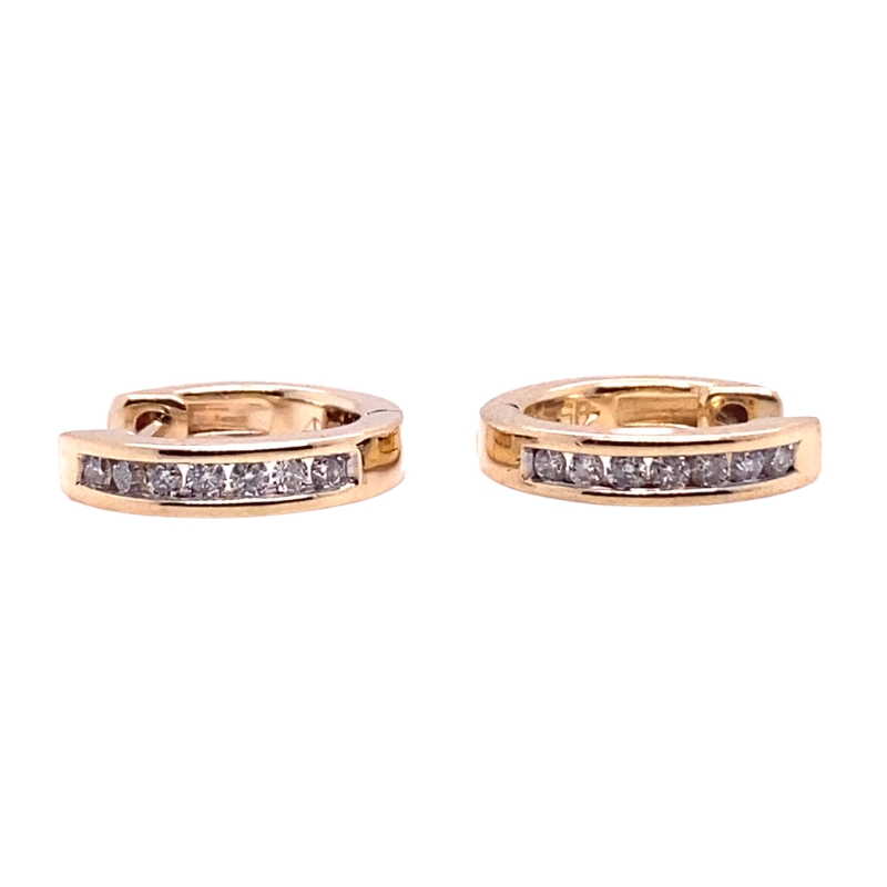 two gold rings with white diamonds on them