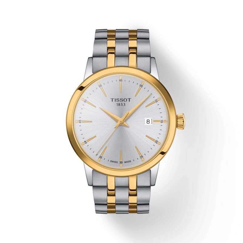 a gold and silver watch on a white background