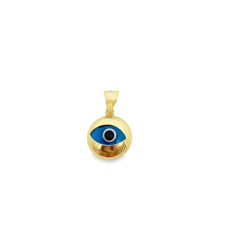 a gold pendant with an evil eye on it