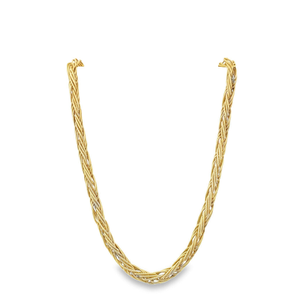 a gold necklace on a white background