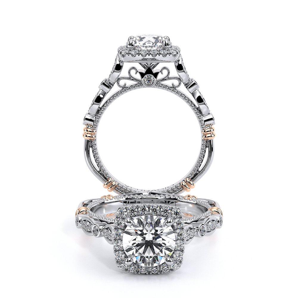 a diamond engagement ring with two tone gold accents