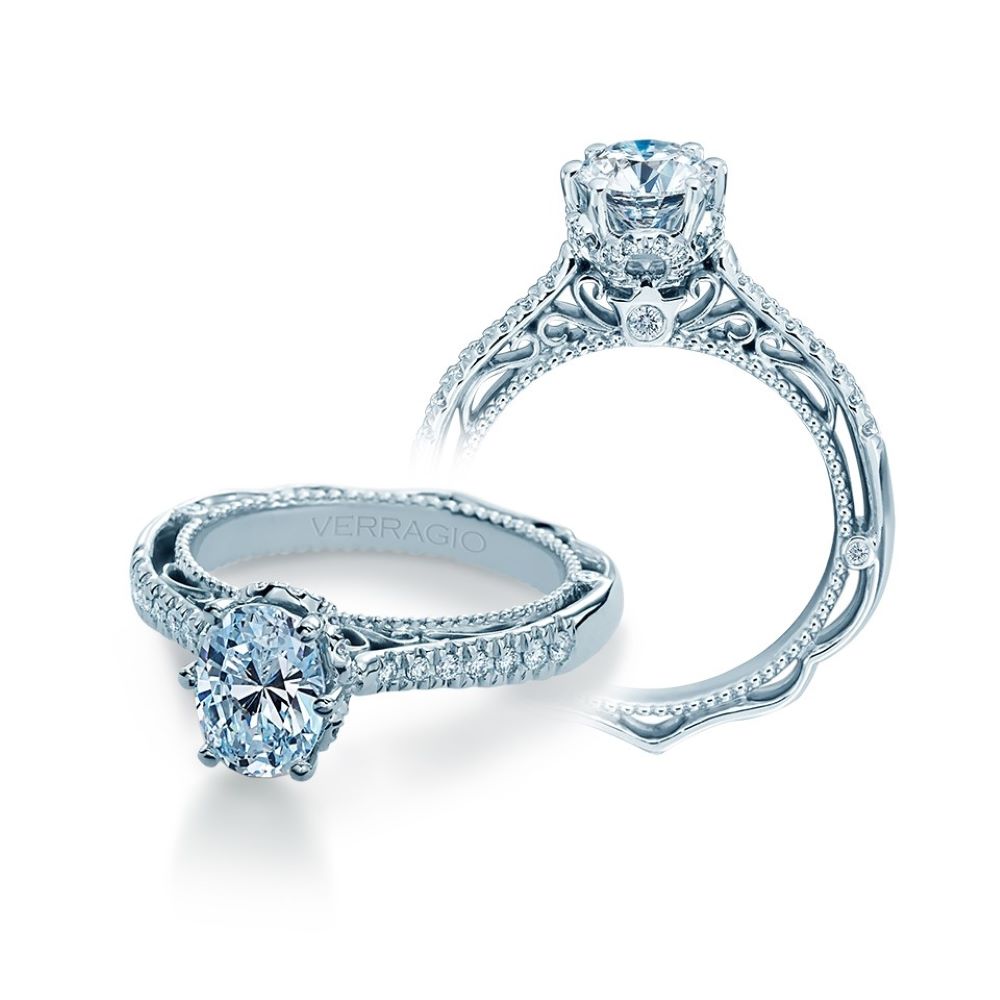 a diamond engagement ring with an intricate band