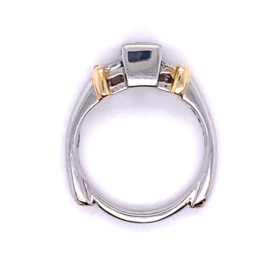 a ring with two tone gold and silver accents