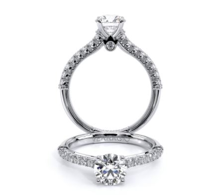a white gold engagement ring with a round diamond