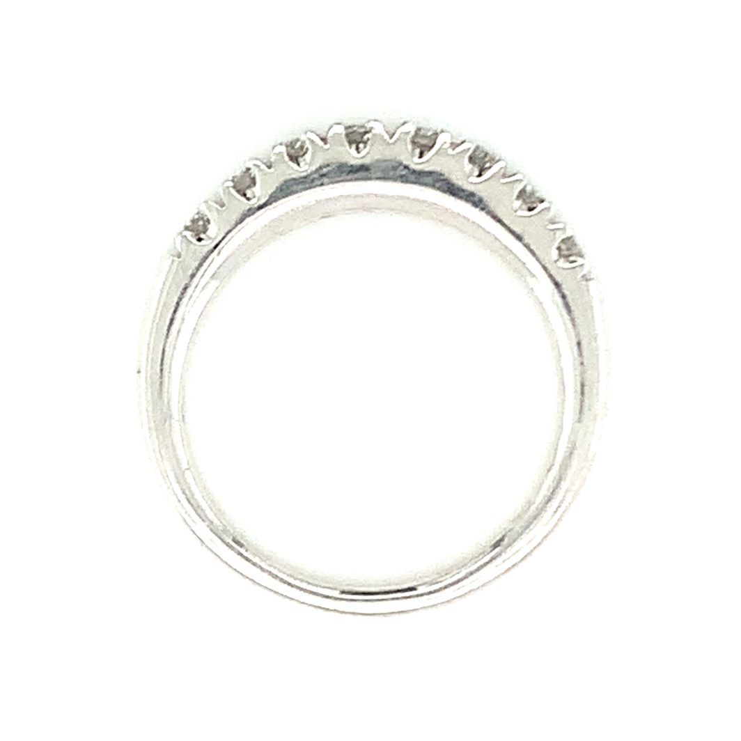 a white gold ring with small diamonds