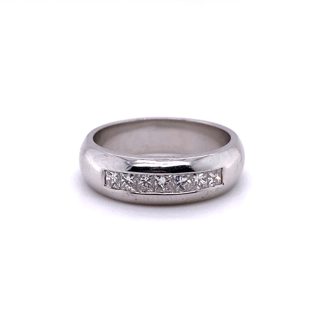 a white gold ring with princess cut diamonds