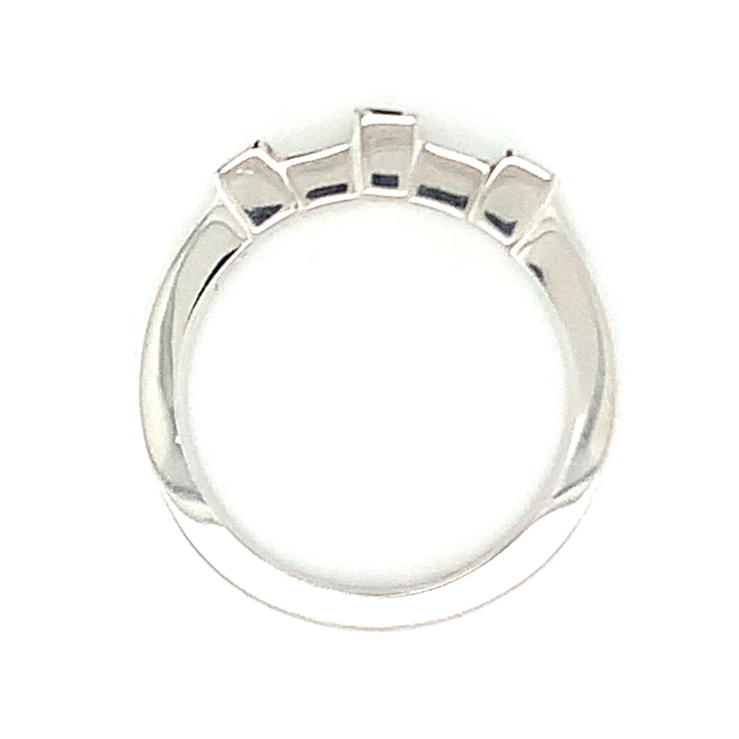 a white gold ring with five stones on the side