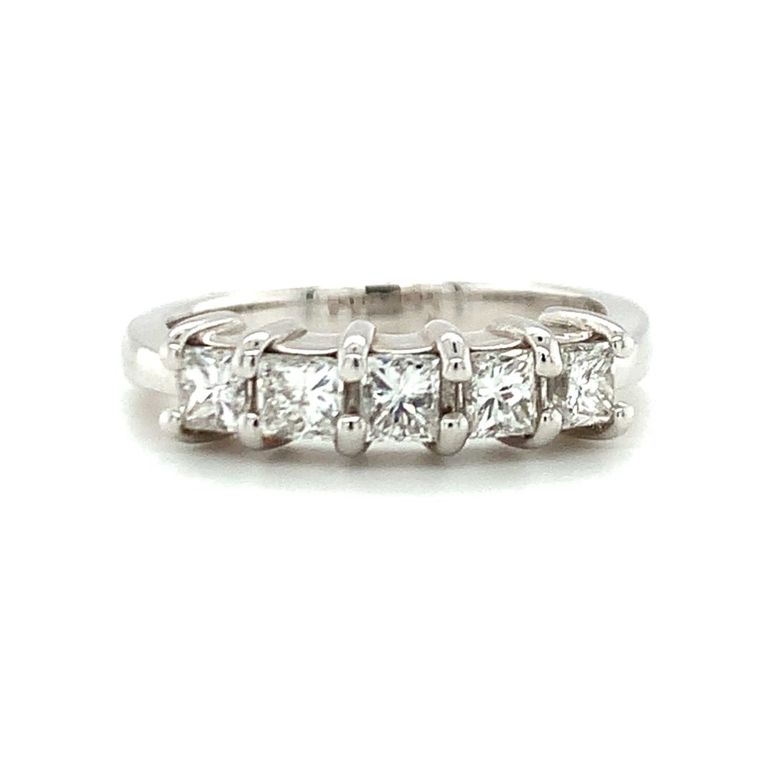 a white gold ring with five princess cut diamonds