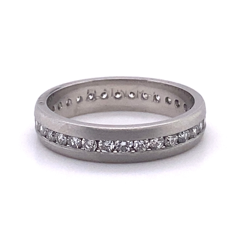 a white gold wedding band with channeled diamonds