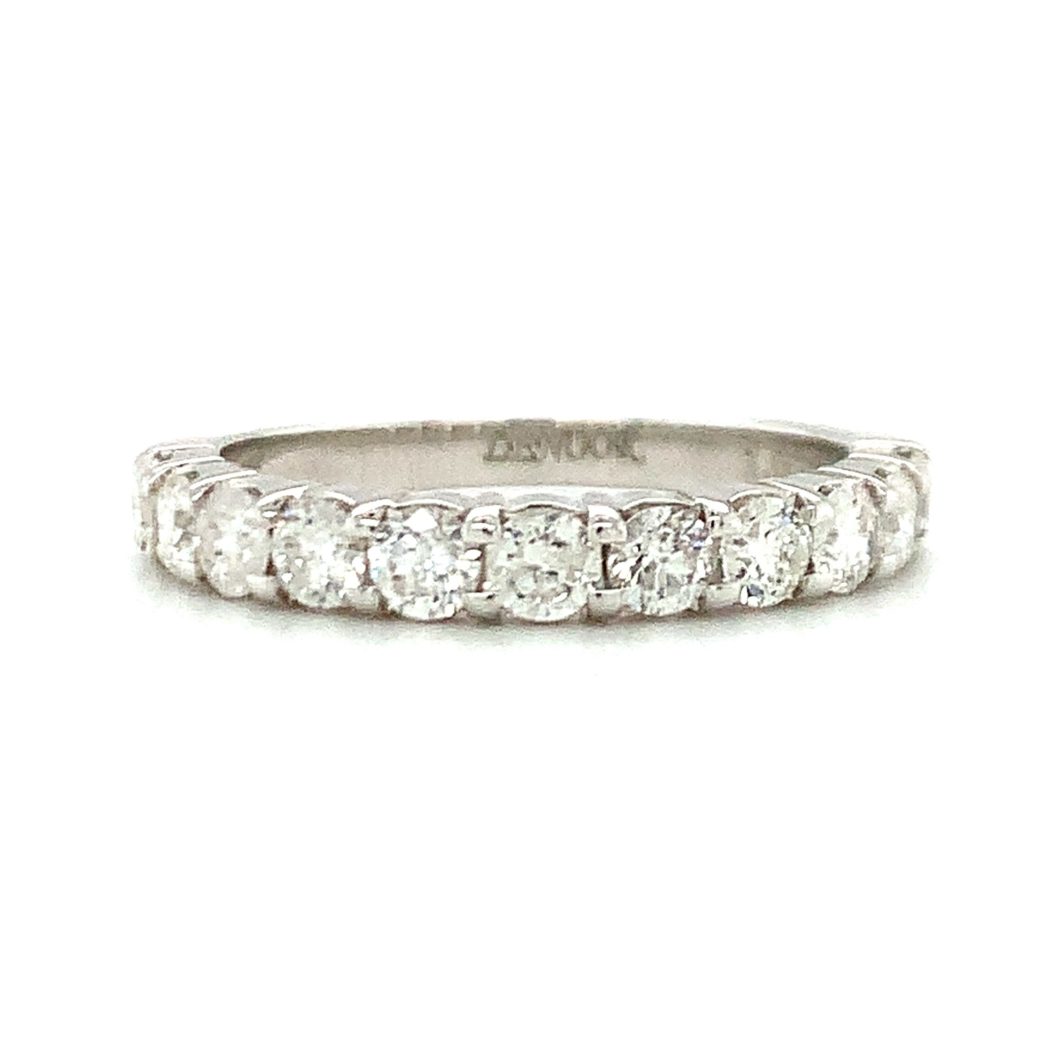 a white gold wedding band with five round diamonds