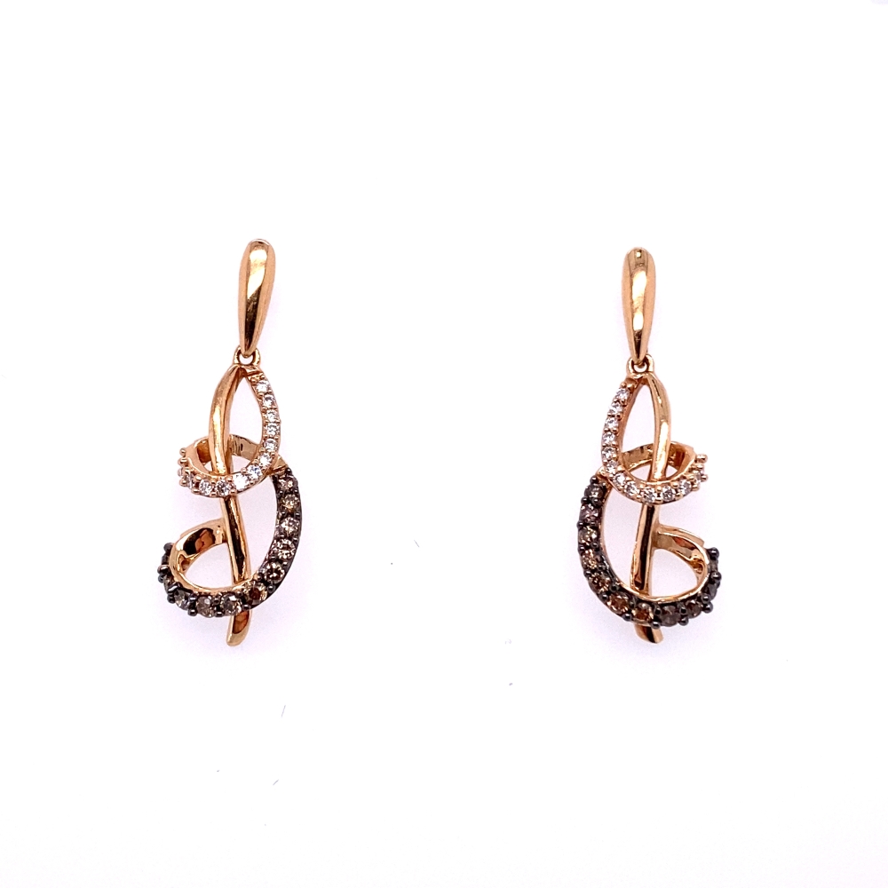 a pair of gold and diamond earrings