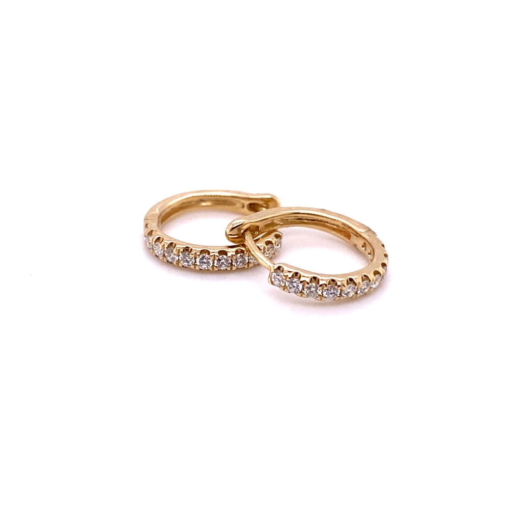 two gold rings with diamonds on them