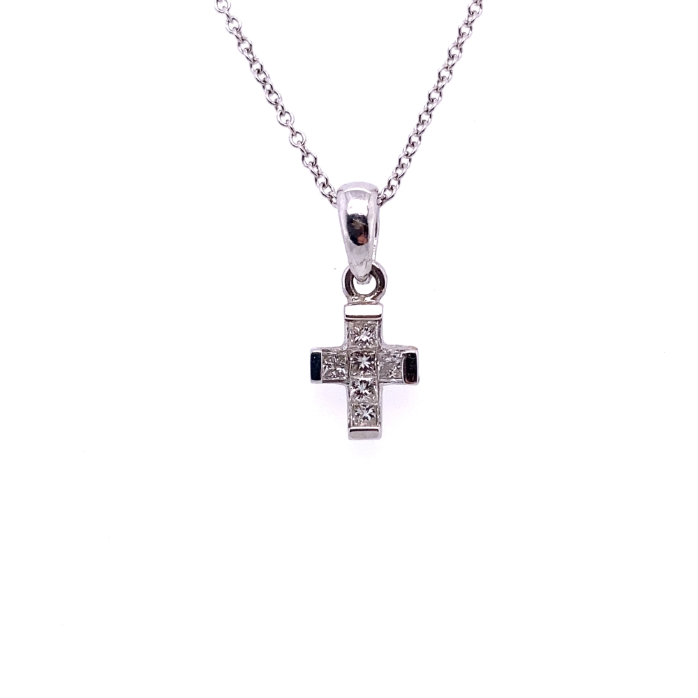 a cross necklace with black and white stones