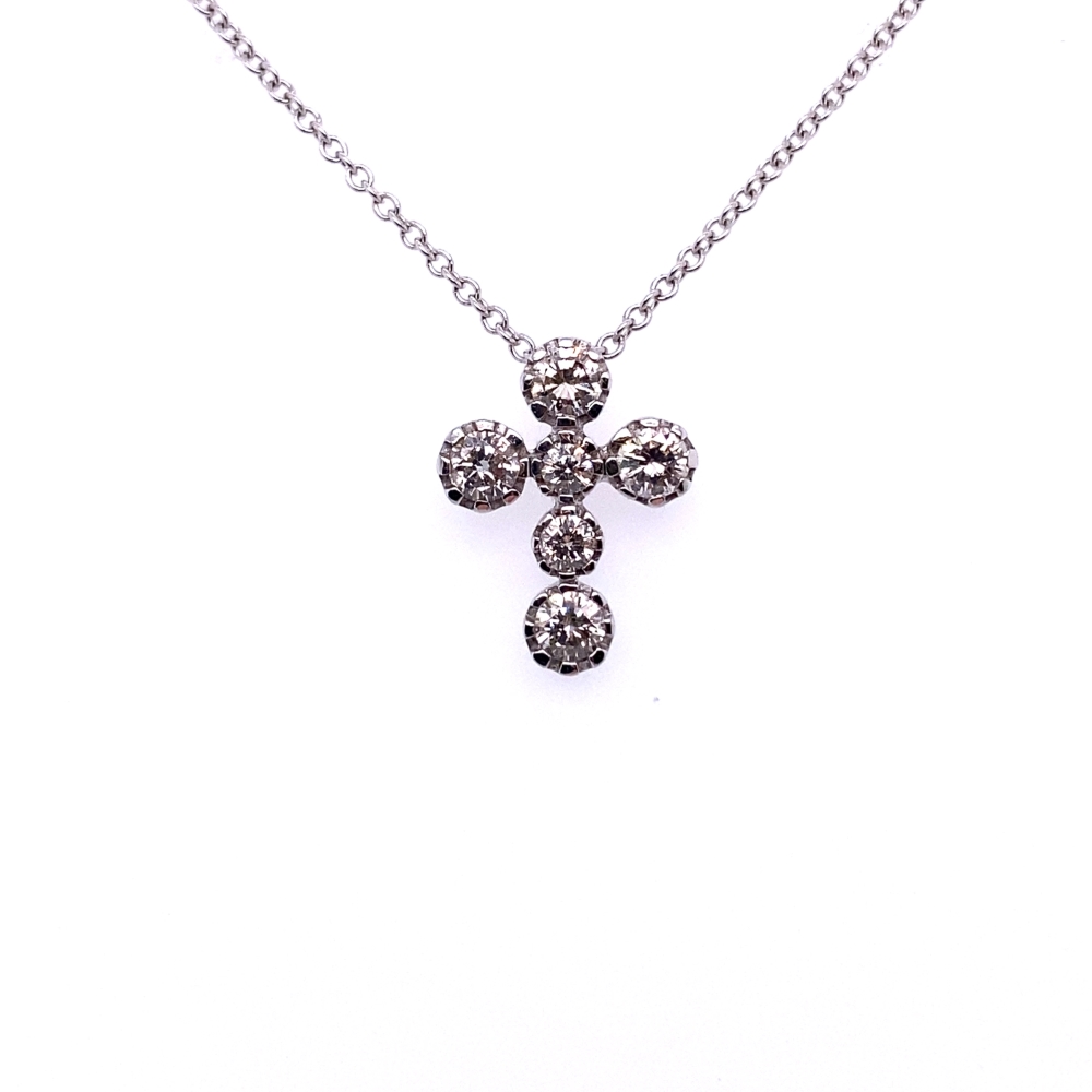 a cross necklace with three stones on it