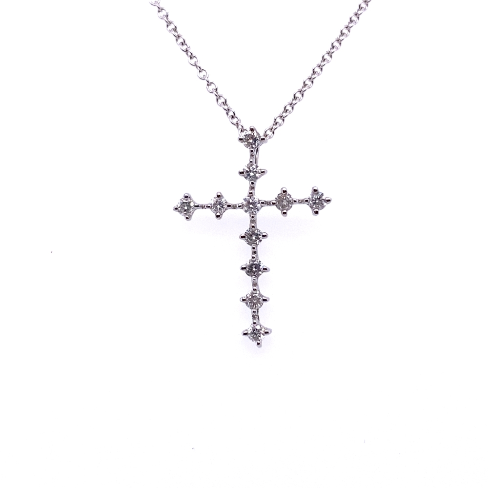 a cross necklace with four diamonds on it