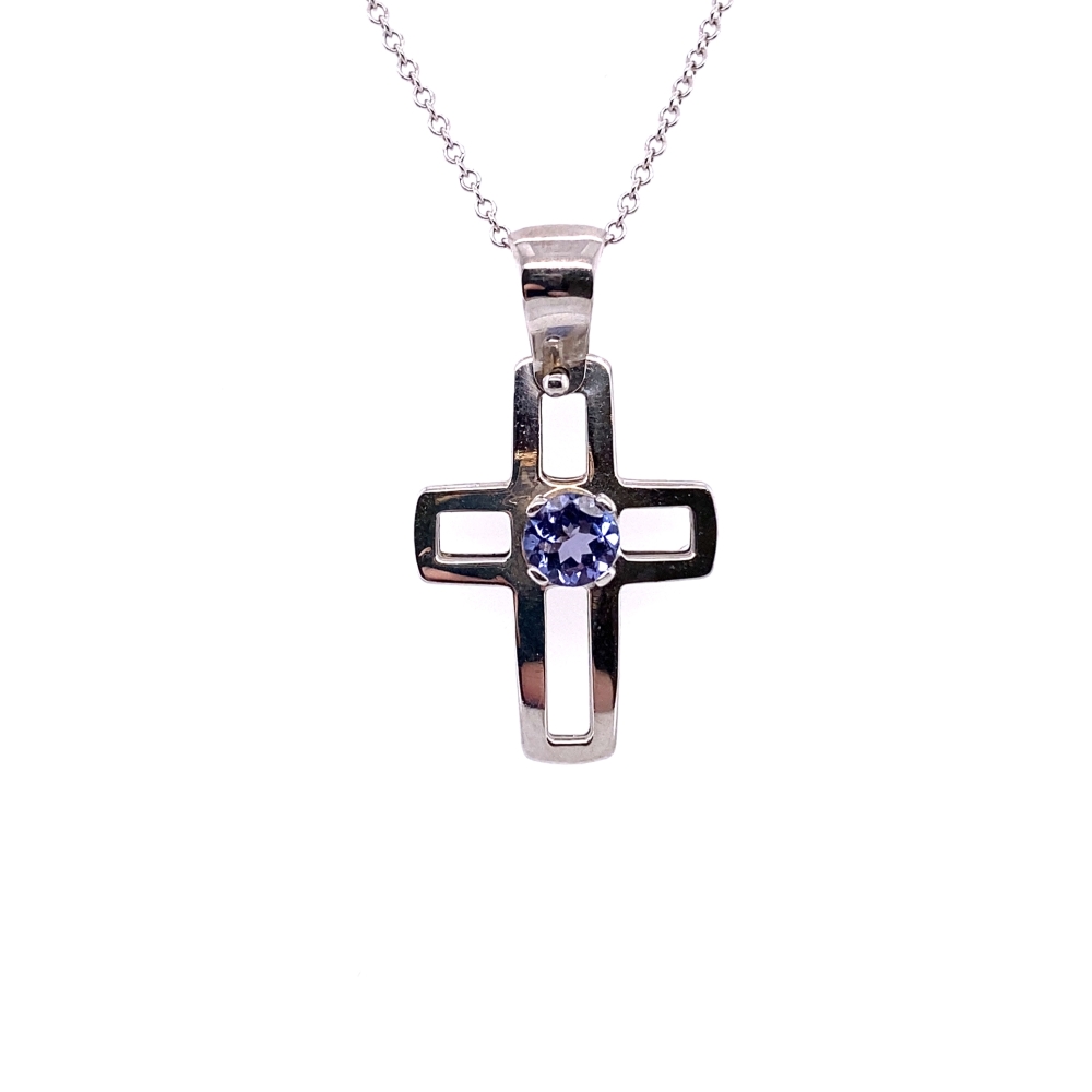 a cross pendant with a blue stone in the center