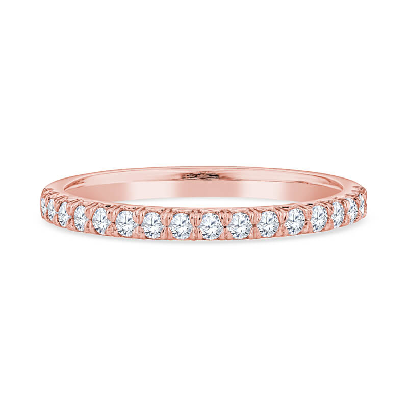 a rose gold wedding band with round diamonds