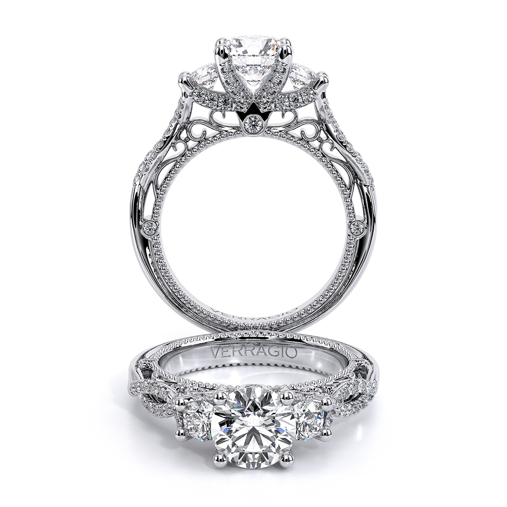 a diamond engagement ring with three stones on the side
