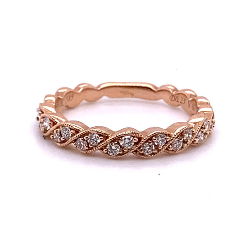 a rose gold ring with diamonds on it