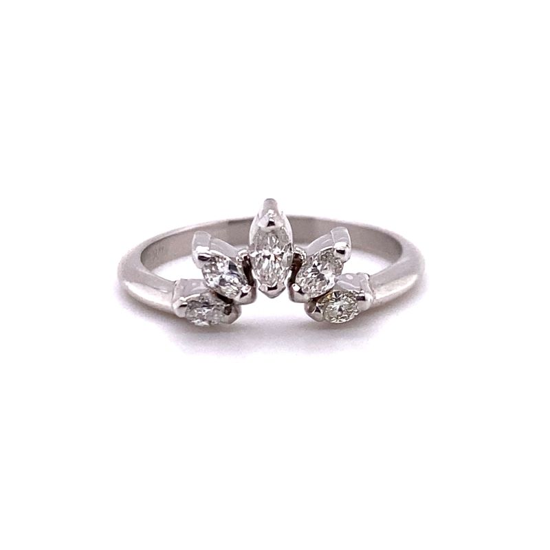 a white gold ring with three pear shaped diamonds