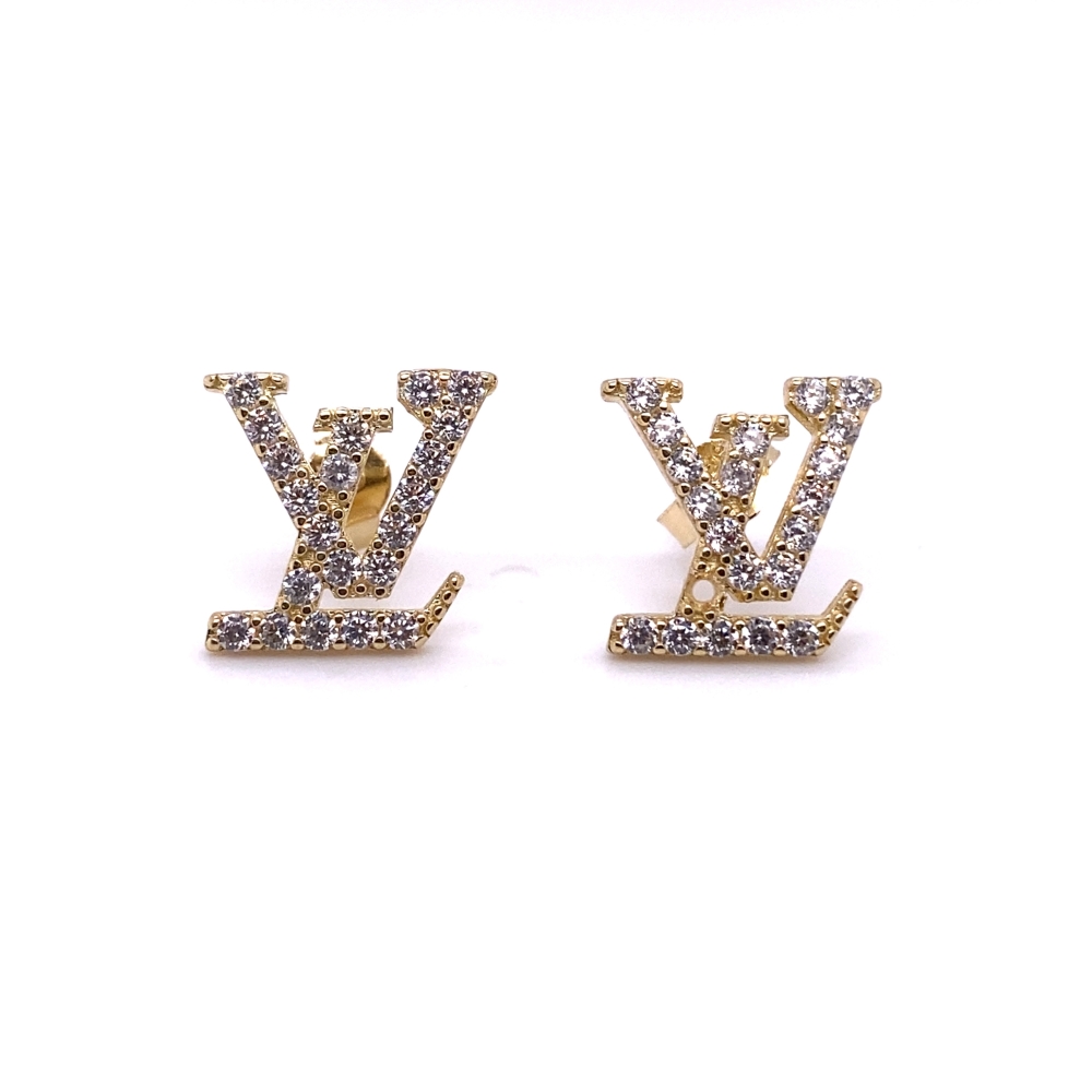 two pairs of earrings with the letter y on them
