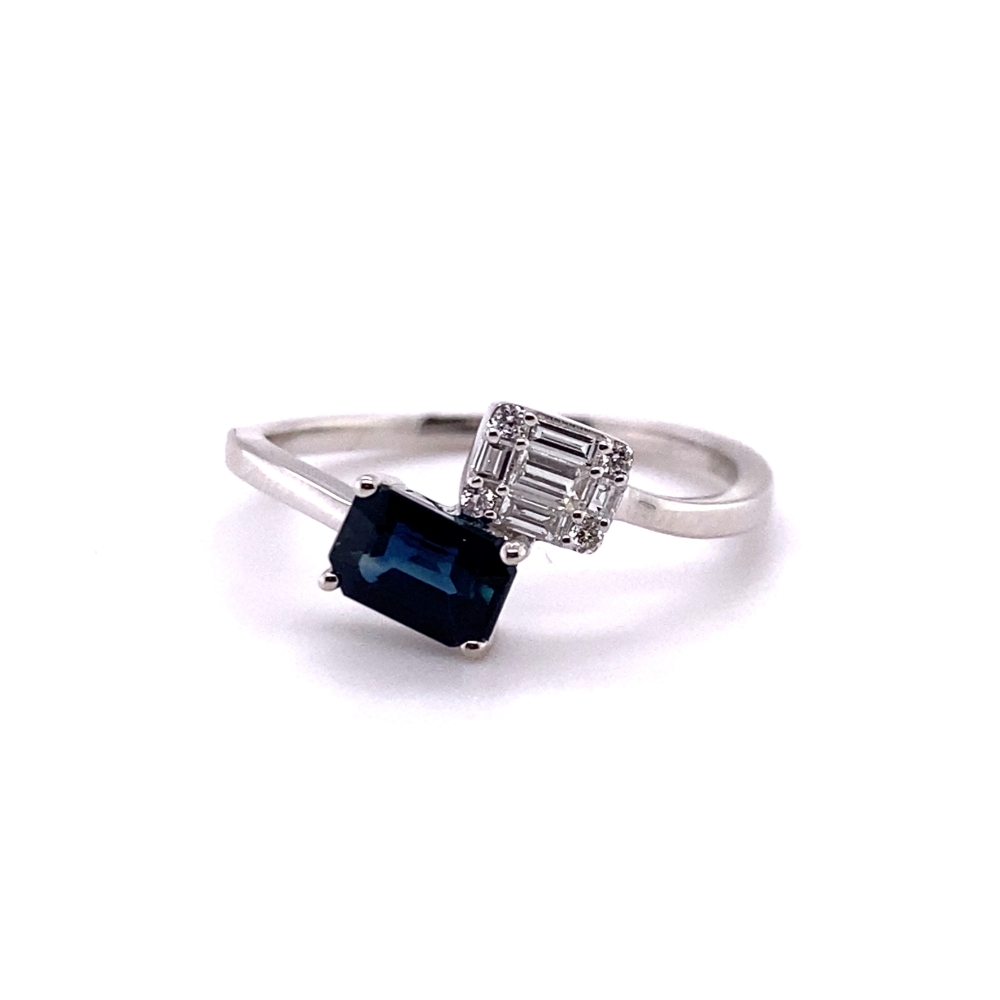 an engagement ring with a blue stone and two diamonds