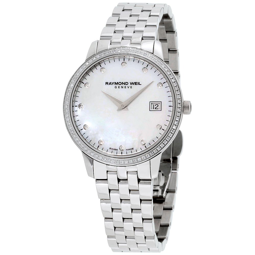 a women's watch with white dial and diamond bezel