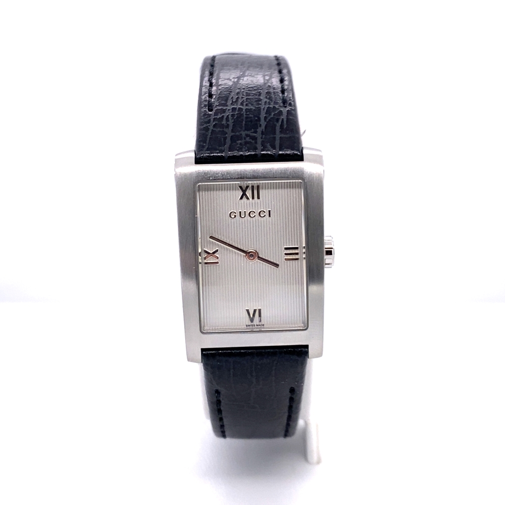 a watch with black leather band and roman numerals