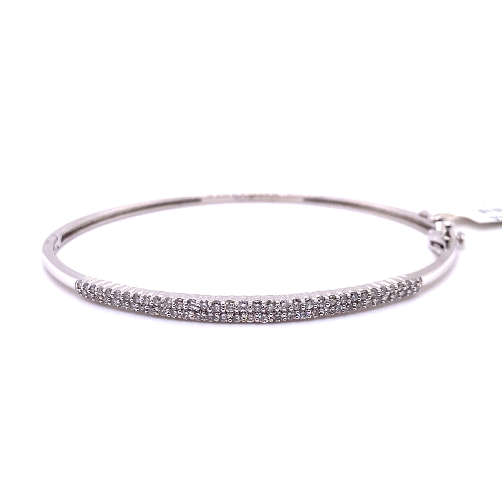 a silver bracelet with clear stones on it