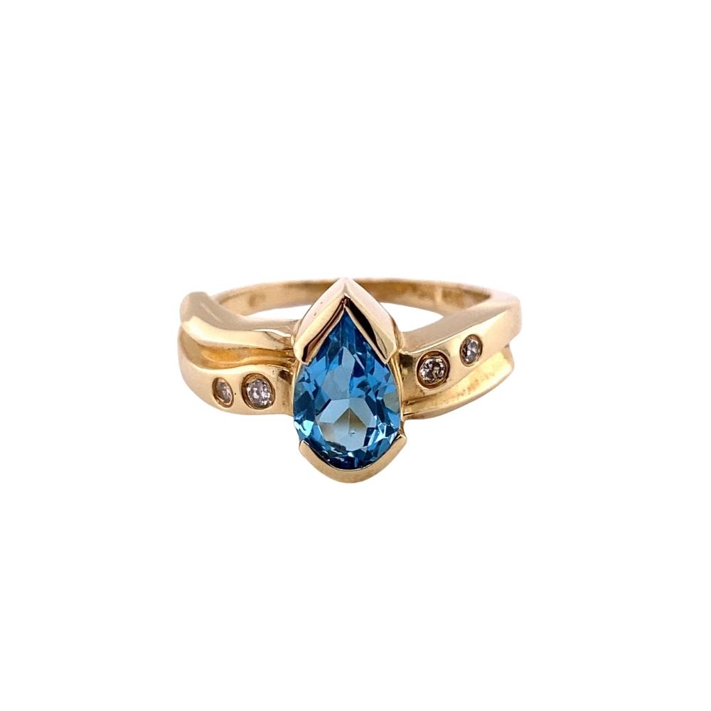 a gold ring with a blue stone and diamonds