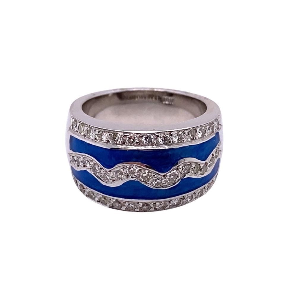 a blue and white ring with diamonds on it