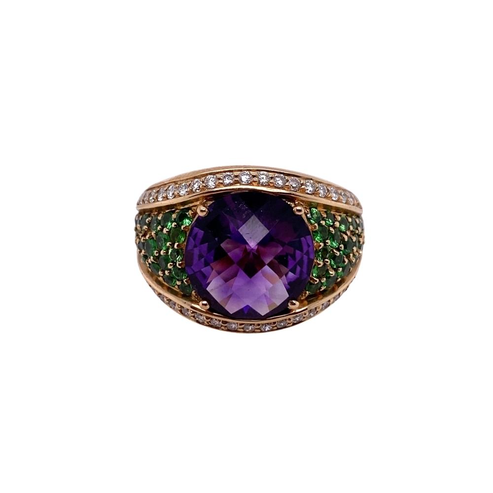 a purple ring with green and white stones