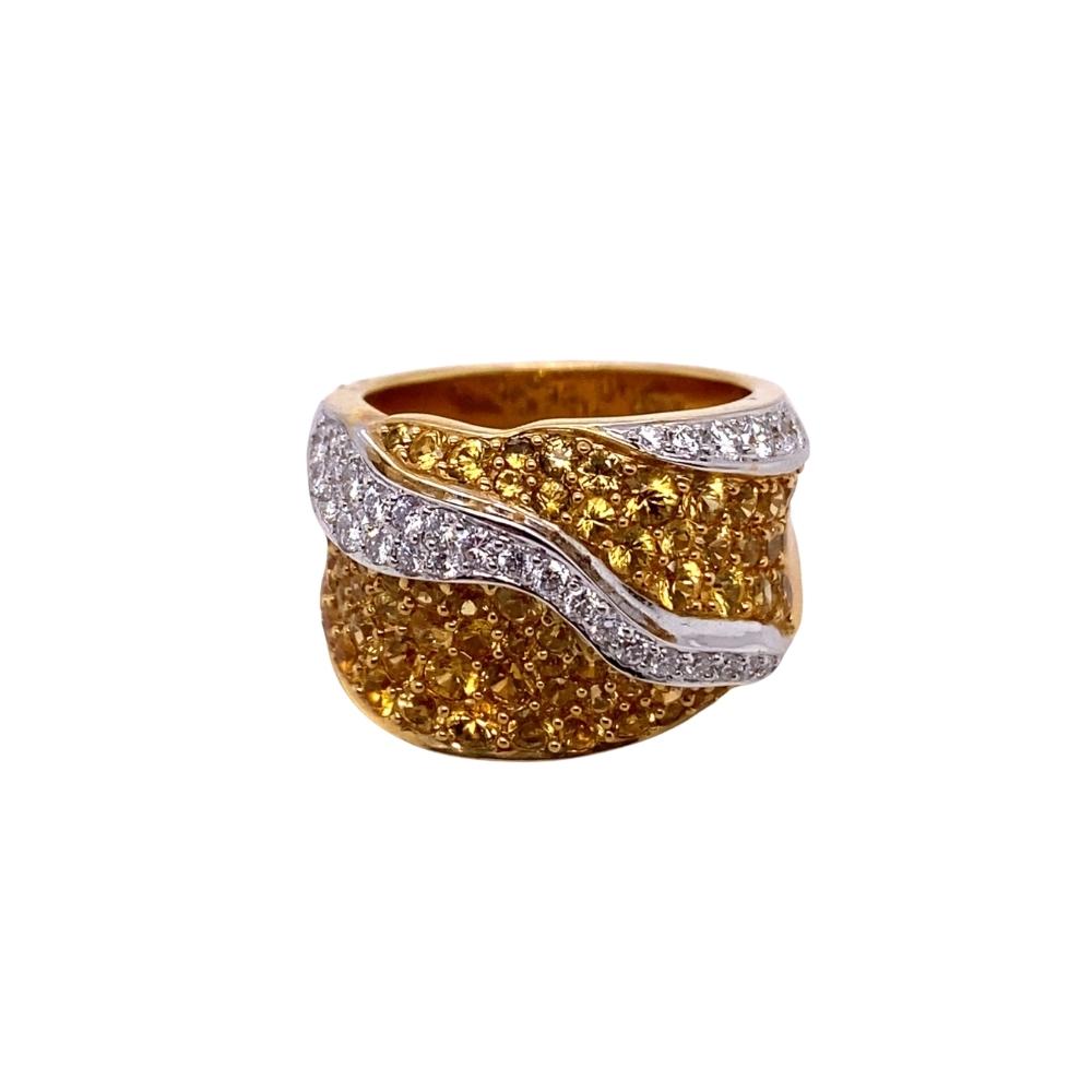 a gold and white ring with two rows of diamonds