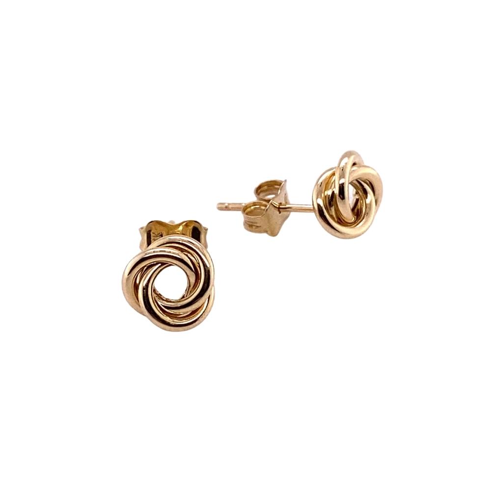 a pair of gold toned earrings on a white background