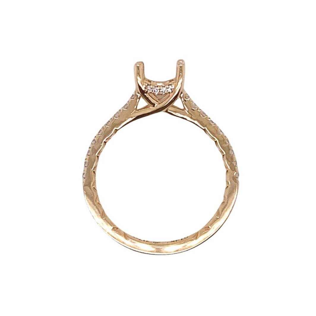 a yellow gold ring with a diamond set in the center