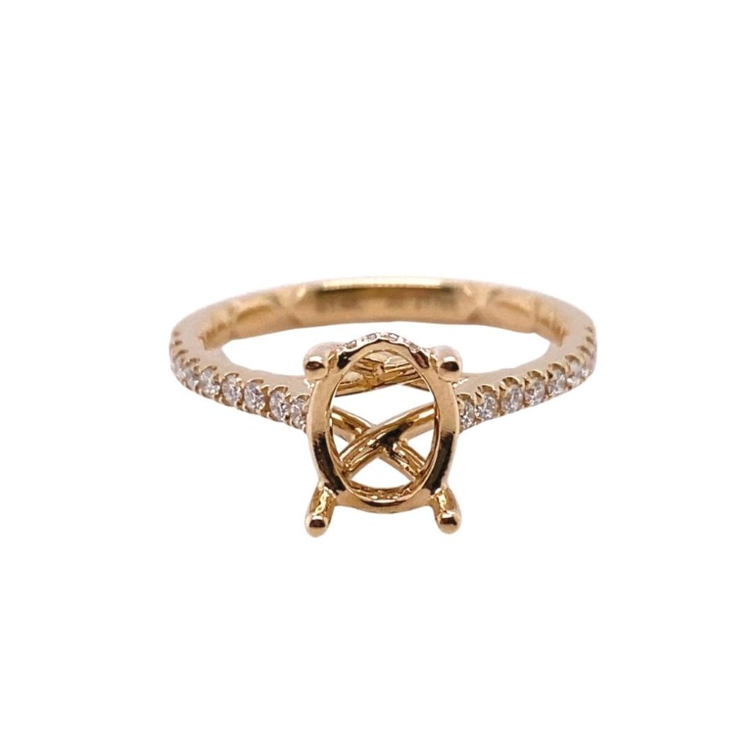 a gold ring with a diamond set in the middle