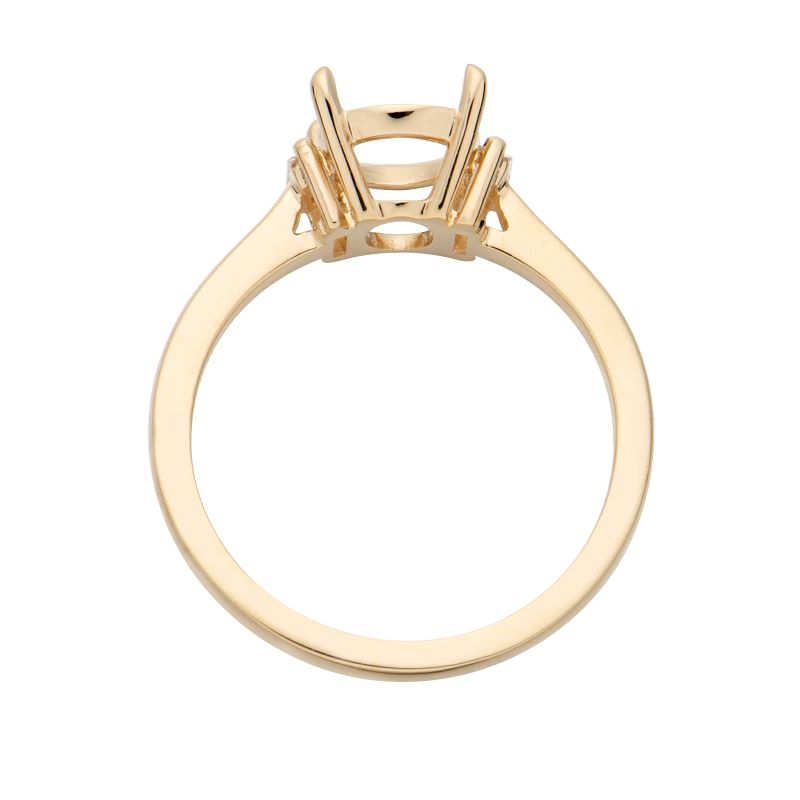 a yellow gold ring with three stones