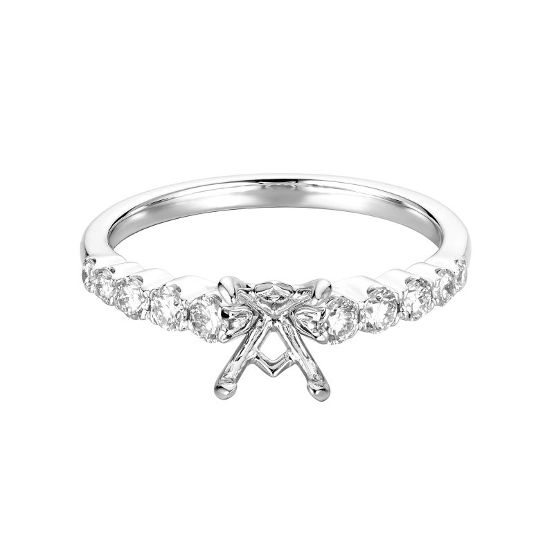 a white gold ring with an arrow shaped diamond