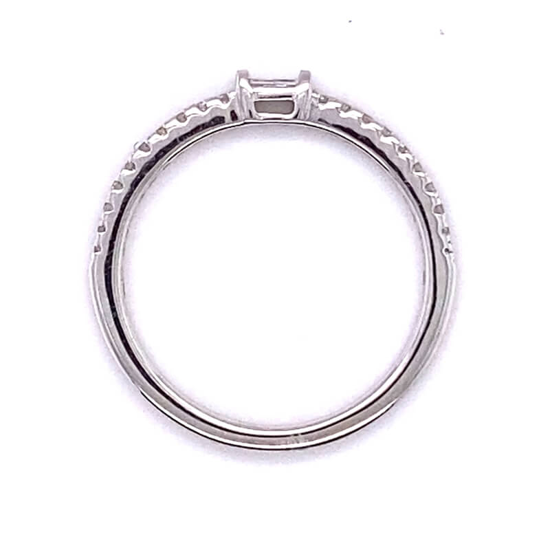 a white gold ring with a diamond set in the center