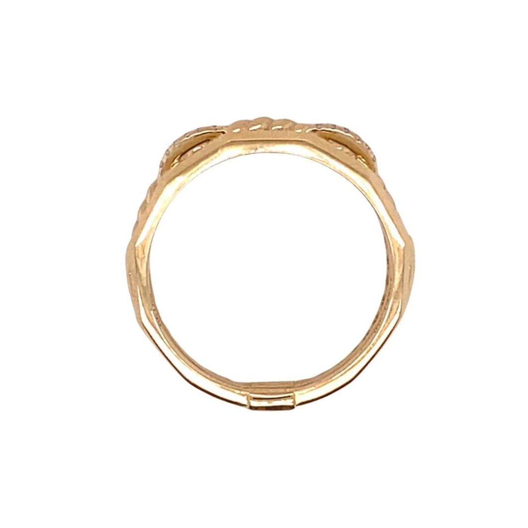 a gold ring with three small leaves on it