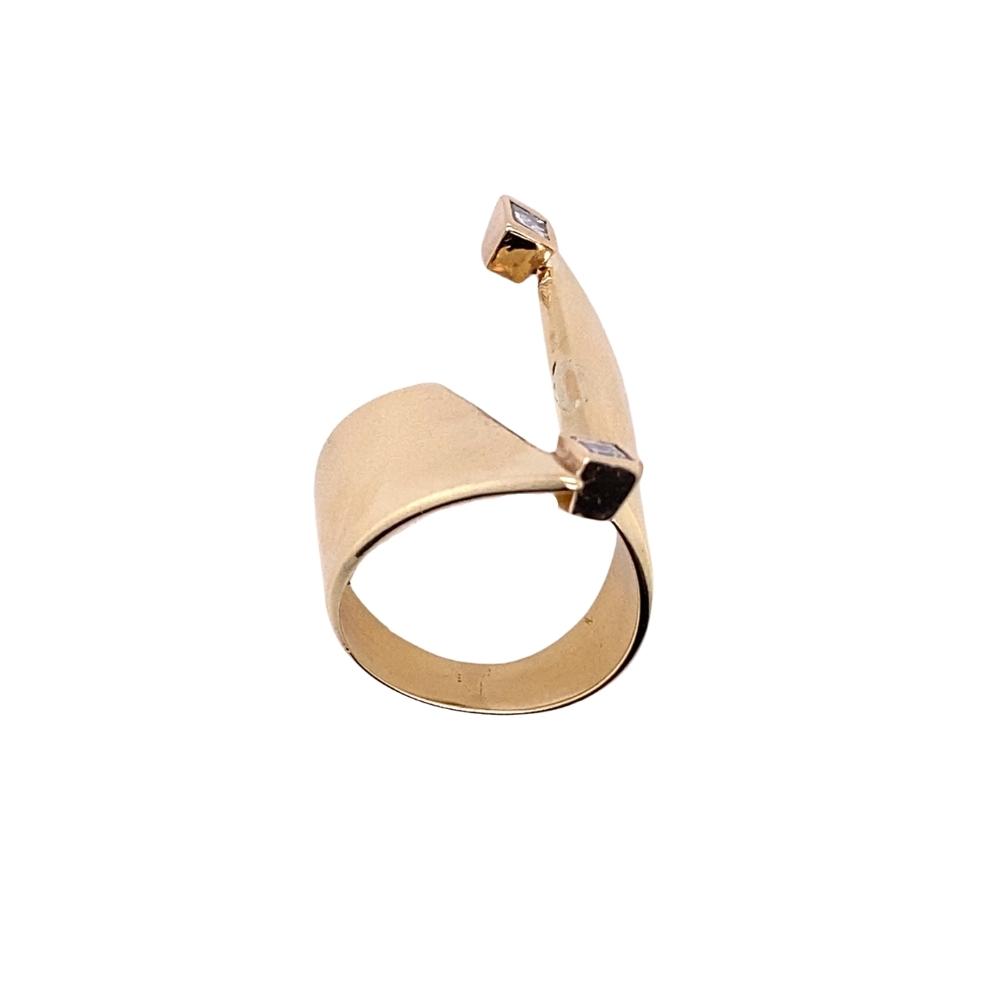 a gold ring with a curved design on it