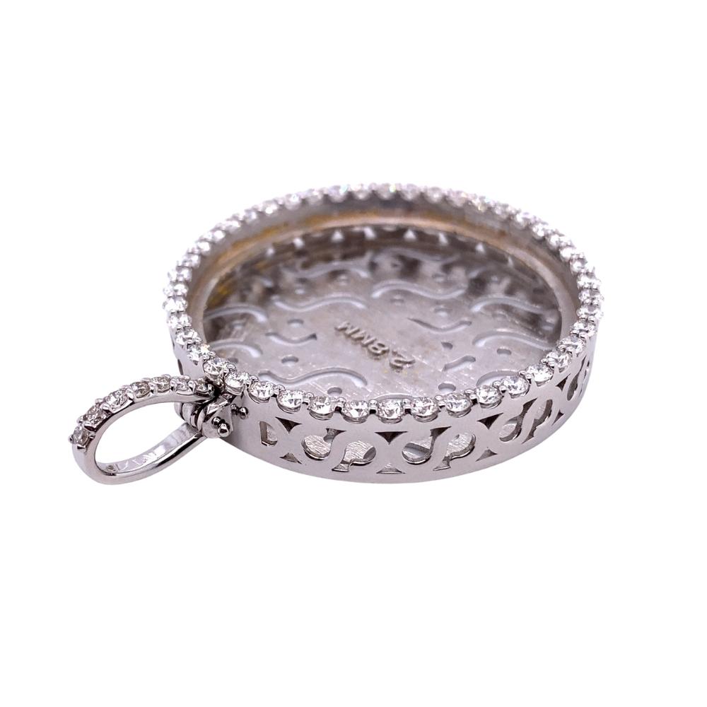 a silver tray with a keychain on it