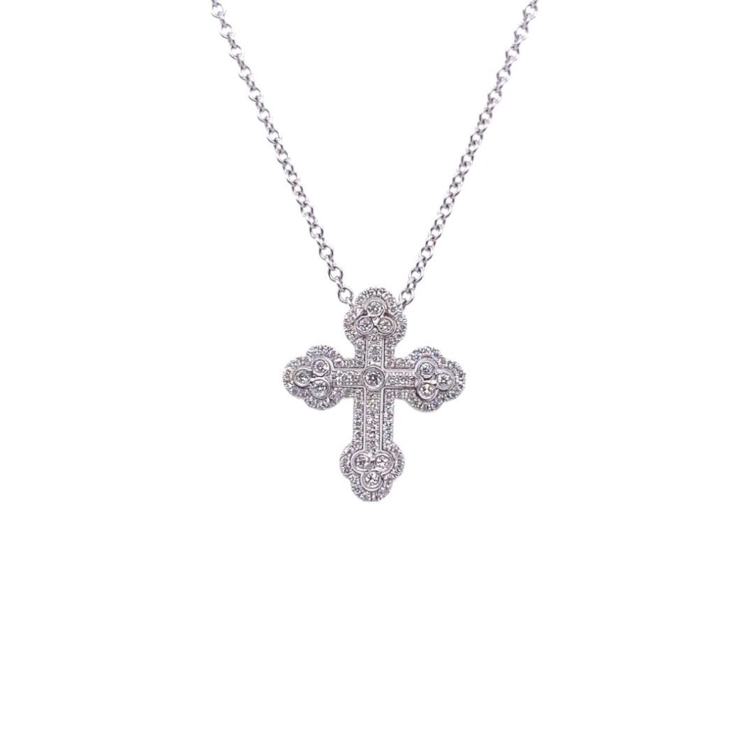 a cross necklace with diamonds on it